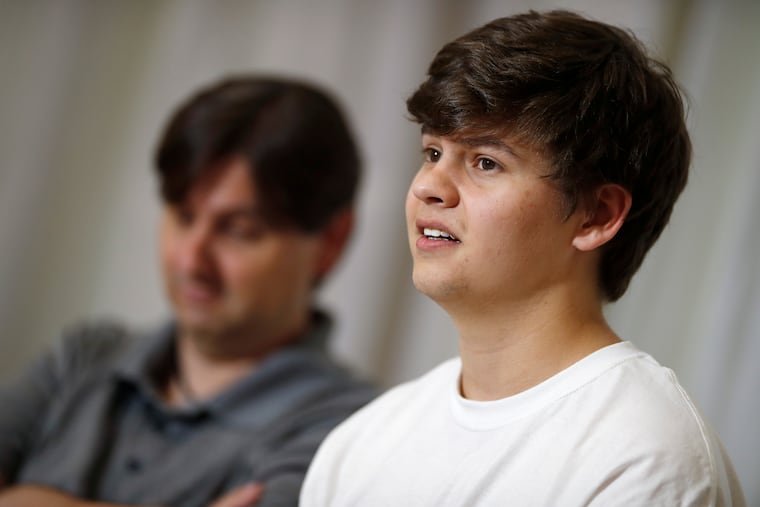 Joshua Jones, who was wounded while trying to stop a gunman involved in the attack on the STEM School Highlands Ranch last week, speaks during a news conference as his father, David, listens Tuesday, May 14, 2019, in Littleton, Colo. Jones, Kendrick Castillo, and Brendan Bialy tackled the teen who opened fire at STEM School Highlands Ranch south of Denver on May 7. Castillo was fatally shot.