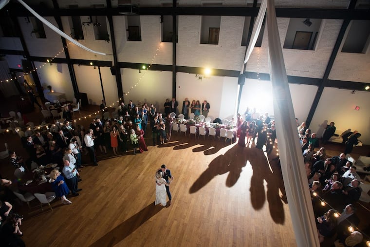 In March, Daniel Garrison and now-wife Jenna dance inside the Skybox Event Center in Fishtown.