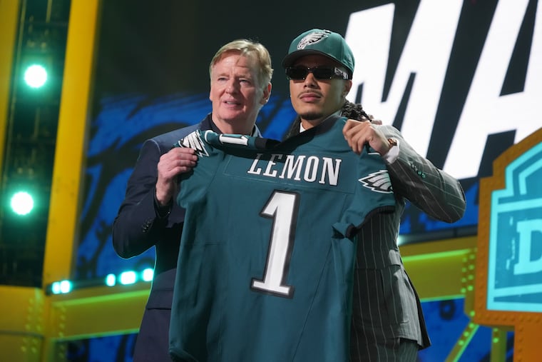 Makai Lemon (right, with NFL commissioner Roger Goodell) offers another weapon for a new-look Eagles offense.