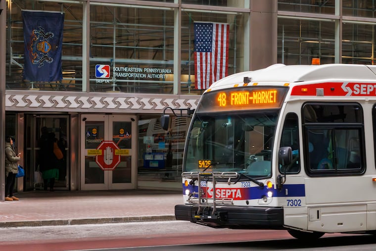 SEPTA route 48 bus passes in front of SEPTA headquarters , 1234 Market St. Philadelphia.