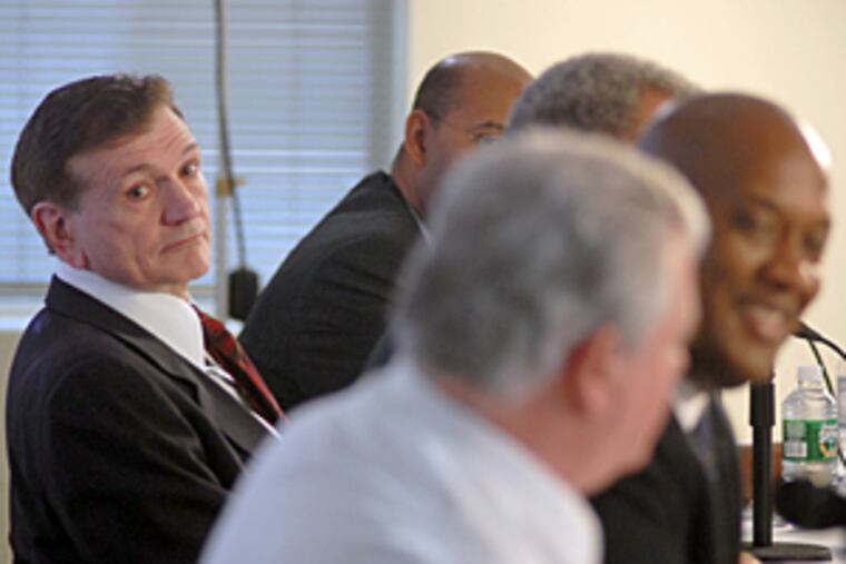 Democratic mayoral candidate Tom Knox (left) looks toward Bob Brady
(front) after he was target of a Brady comment during the first live
debate in the primary campaign.