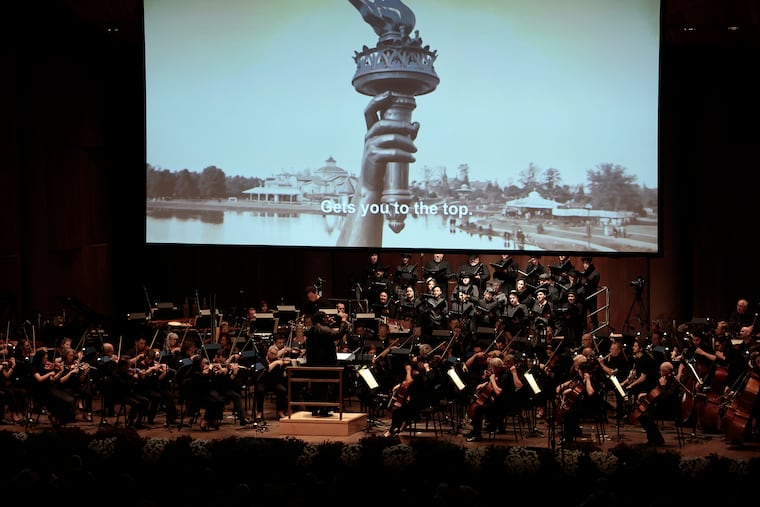 Conductor Anthony Parnther leads the Philadelphia Orchestra and the Crossing choir in the world premiere of "A Hundred Years On" at the Highmark Mann Center on Wednesday.