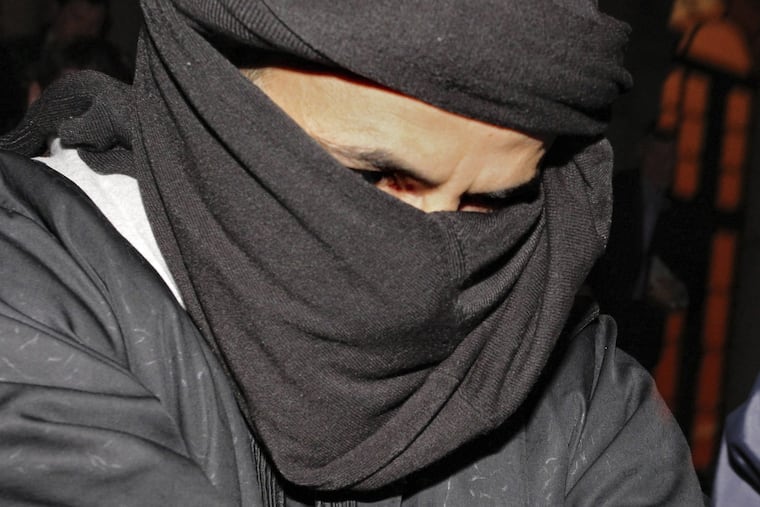 In this March 15, 2010, file photo, Ali Charaf Damache arrives at the courthouse in Waterford, Ireland.