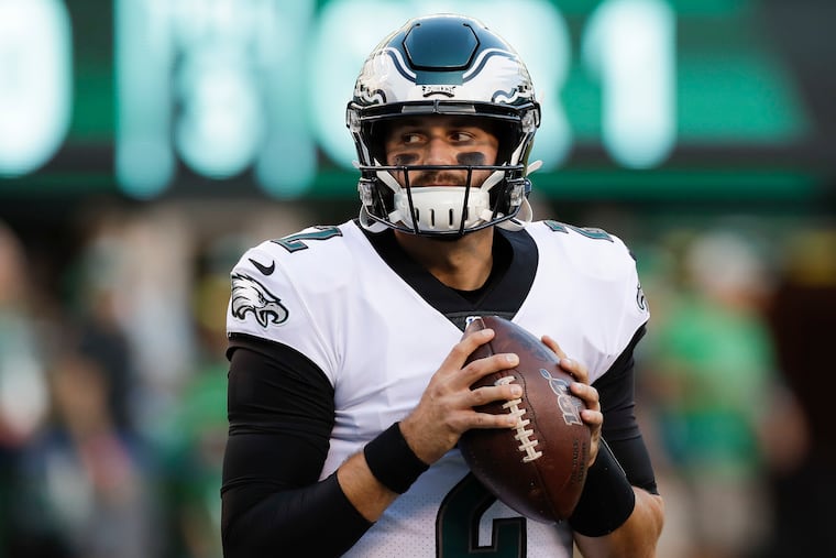 Eagles quarterback Cody Kessler holds the football during pregame warm-ups before the Eagles' final preseason game against the Jets. Kessler, who was cut Friday, didn't play in the game.