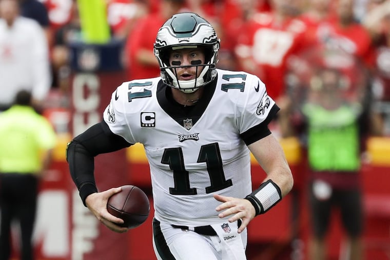 Eagles quarterback Carson Wentz runs with the football against the Kansas City Chiefs on Sunday, September 17, 2017 in Kansas City, Mo. YONG KIM / Staff Photographer