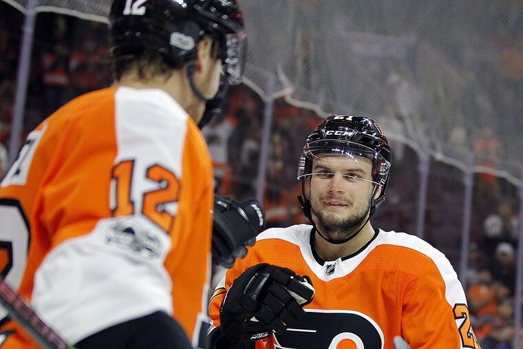 Philadelphia Flyers’ Scott Laughton, right, approaches Michael Raffl, left, who got the assist on Laughton’s goal during the second period of an NHL preseason hockey game against the New York Rangers , Tuesday, Sept. 26, 2017, in Philadelphia.