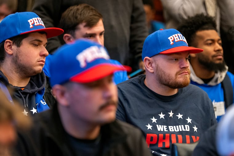 Union workers listen to Council President Kenyatta Johnson and Mayor Cherelle L. Parker in the Mayor’s Reception Room at City Hall on Dec. 19, after Council gave final approval to the Sixers arena.