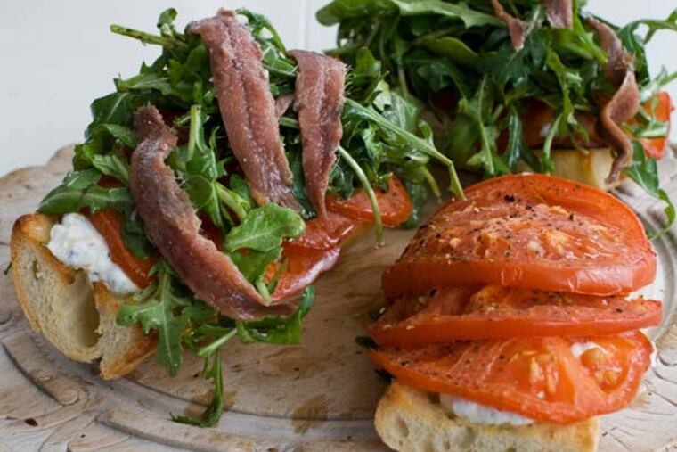 In this image taken on Feb. 11, 2013, an open-faced anchovy sandwich with balsamic arugula is shown served on a plate in Concord, N.H. (AP Photo/Matthew Mead)
