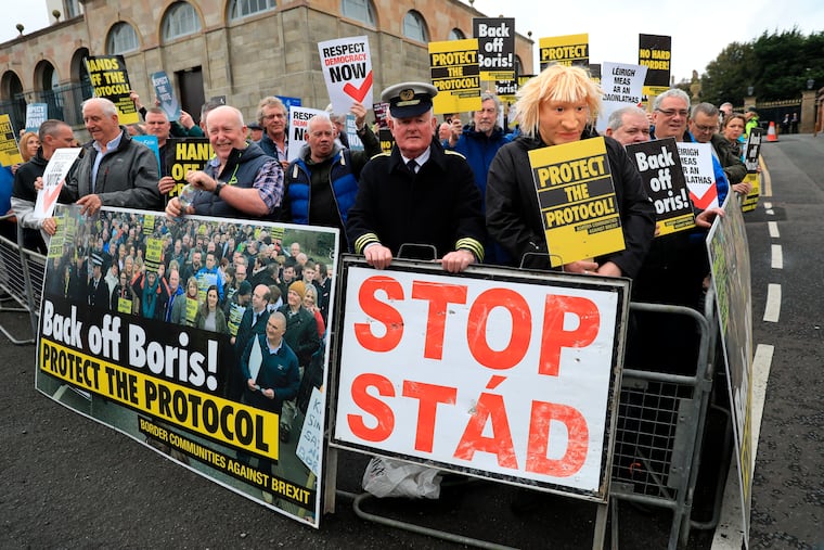 Border Communities Against Brexit protest outside Hillsborough Castle, Northern Ireland, Monday, May 16, 2022. The protest was staged as British Prime Minister Boris Johnson arrived for talks with local political leaders.
