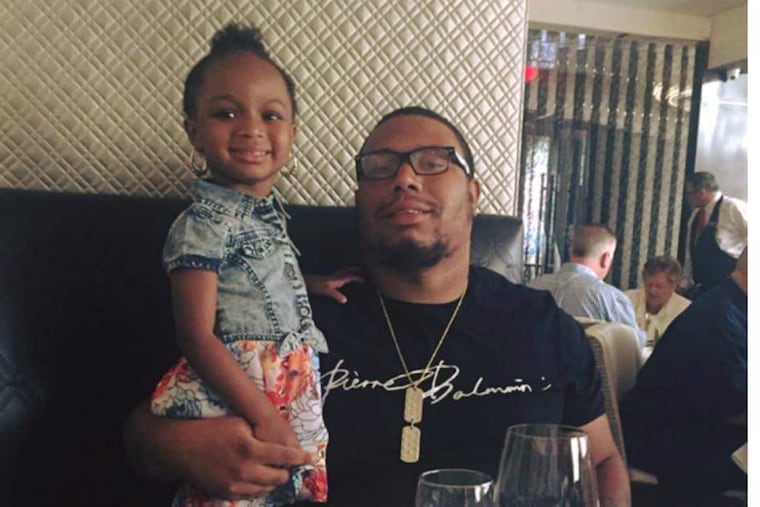 Cameron Robertson with his daughter, Riley, 3, on Father's Day. Robertson, 26, was shot and killed on Aug. 1, 2016.