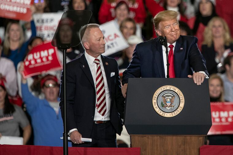 President Donald Trump smiles while Rep. Jeff Van Drew (R., N.J.) stands next to him at a Keep America Great campaign rally in Wildwood, N.J., on Tuesday, Jan. 28, 2020. Van Drew switched over to the Republican Party.