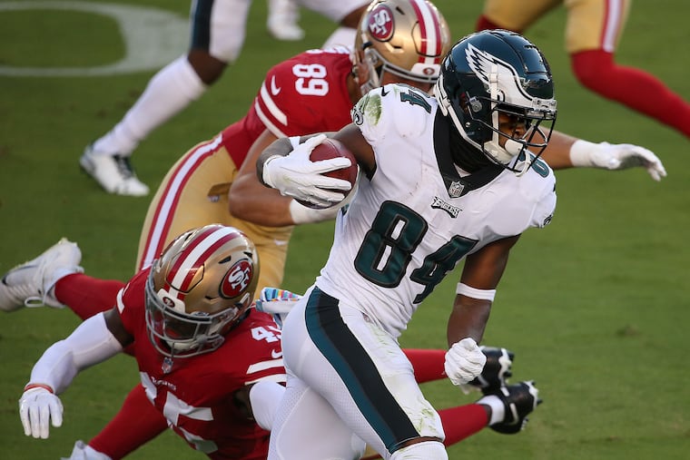 Eagles wide receiver Greg Ward (right) avoid a tackle by San Francisco 49ers linebacker Demetrius Flannigan-Fowles during the 1st quarter.