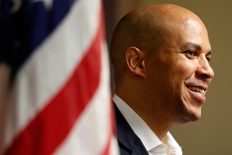 Newark Mayor and U.S. Senate candidate, Cory Booker, smiles during a stop at the North Gate Senior Complex on August 12, 2013. ( DAVID MAIALETTI / Staff Photographer )