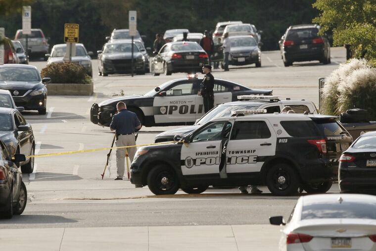 Police investigate a shooting at the Springfield Mall in Springfield, Pa. on Oct. 20, 2018.