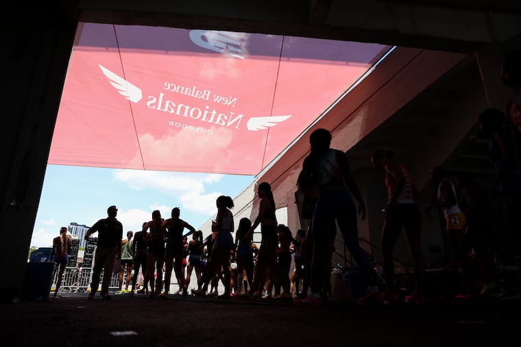 Athletes prepare to take the field during the New Balance Nationals Outdoors Championship at Franklin Field on Sunday.