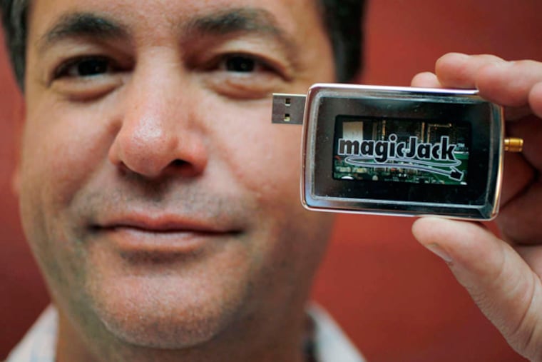 Dan Borislow with a MagicJack, which lets a computer double as a telephone. (AP, File)