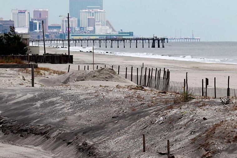A dune in Margate, looking toward Atlantic City. The state is being delayed in an effort to install protective dunes as a post-Sandy move.