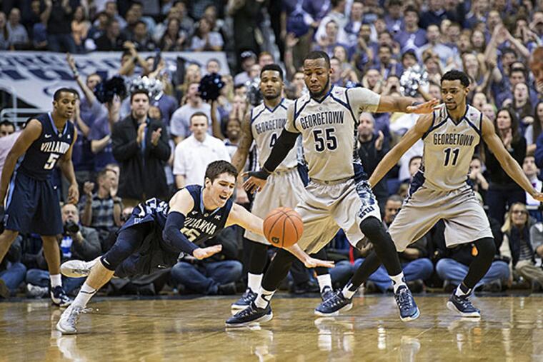 Villanova Wildcats guard Ryan Arcidiacono (15) dives for a loose ball in front of Georgetown Hoyas guard Jabril Trawick (55). (Tommy Gilligan/USA Today)