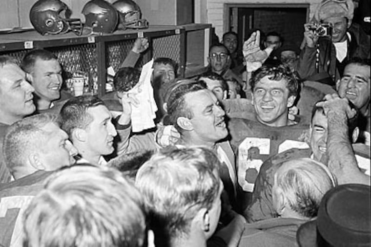 Norm van Brocklin (center) celebrates with his teammates after the Eagles won the 1960 NFL championship. (AP Photo)