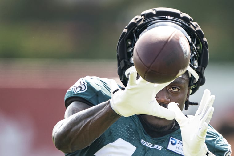 Eagles receiver A.J. Brown catches the ball during a steamy training-camp practice Thursday at the NovaCare Complex.