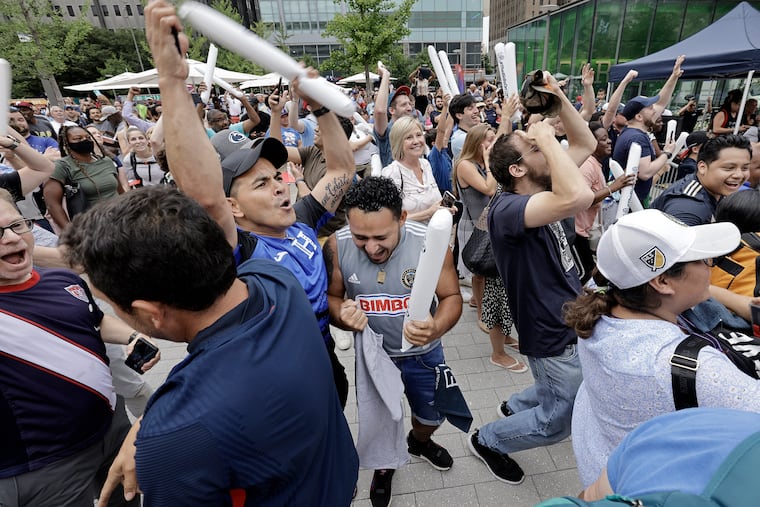Soccer fans react, during a FIFA World Cup 2026 Host Cities watch party in LOVE Park, when it is revealed that Philadelphia was chosen as a men's World Cup tournament host city for the first time in history on June 16, 2022.
