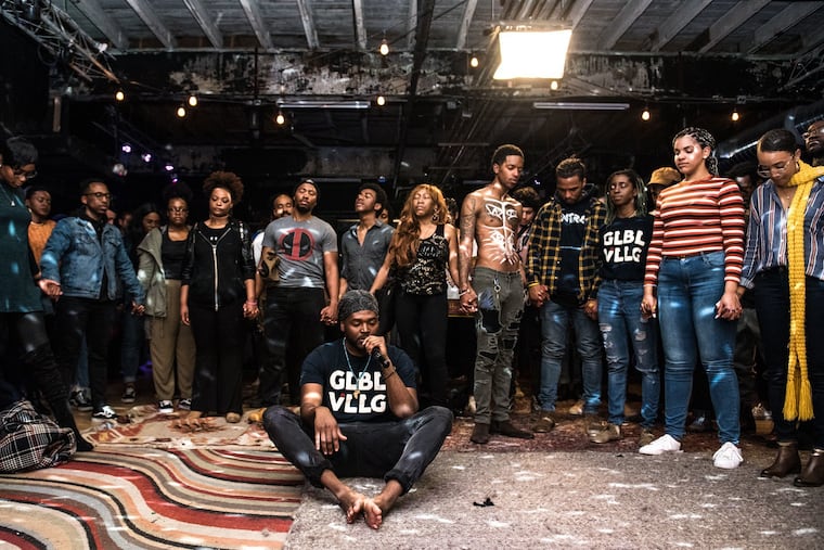 Participants join together for a brief meditation, a rare moment of silence that concludes the GLBL VLLG jam session.