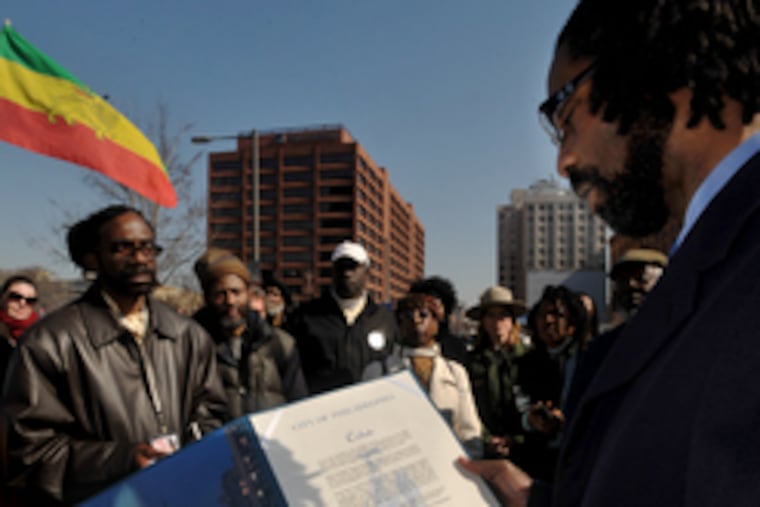 In front of the grounds of the President's House on Independence Mall, activist Michael Coard reads the tribute from Mayor Nutter honoring Oney Judge, a slave of Martha Washington. Story, another photo, B7.