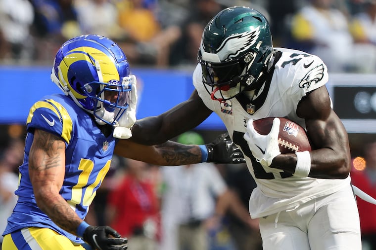 Eagles wide receiver A.J. Brown stiff-arms Rams cornerback Cobie Durant in the third quarter at SoFi Stadium on Sunday.