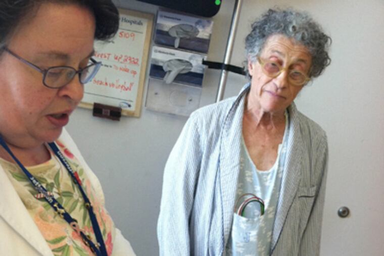 At Jefferson, Joanne Heil works with Pierre Trombert, who has congestive heart failure. (Tom Avril / Staff)