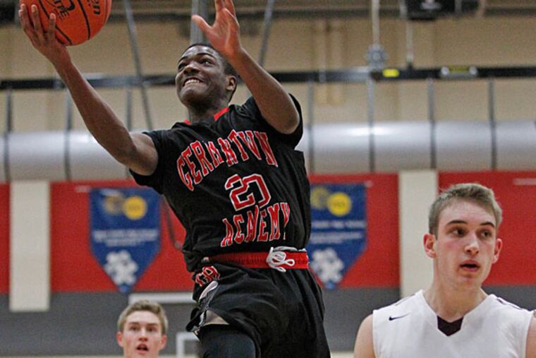 Germantown's Devon Goodman drives to the basket. Conestoga plays Germantown Academy in boys' basketball at Upper Dublin on Friday, December 5, 2014. (Ron Cortes/Staff Photographer)