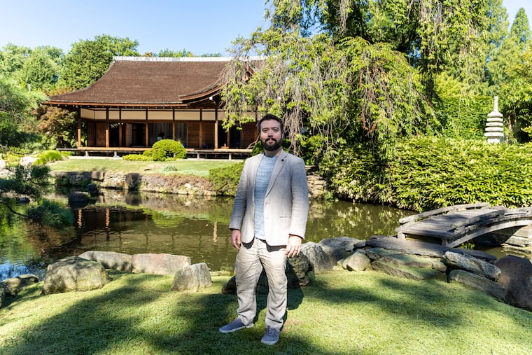 Rob Buscher, Associate Director of Organizational Culture, poses for a portrait at the Shofuso House and Garden in Philadelphia, Pa., on Thursday, Sept. 1, 2022. Three months ago parts of the building were vandalized. The house is undergoing some consulting on how to approach the restoration.
