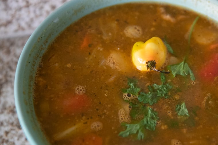 Soup joumou prepared by Marline Idopcil is photographed inside her kitchen at Food Fusion Cuisine in Northeast Philadelphia on Wednesday. Haitians eat soup joumou every year on their Independence Day, which is Jan. 1, as a symbol of freedom.