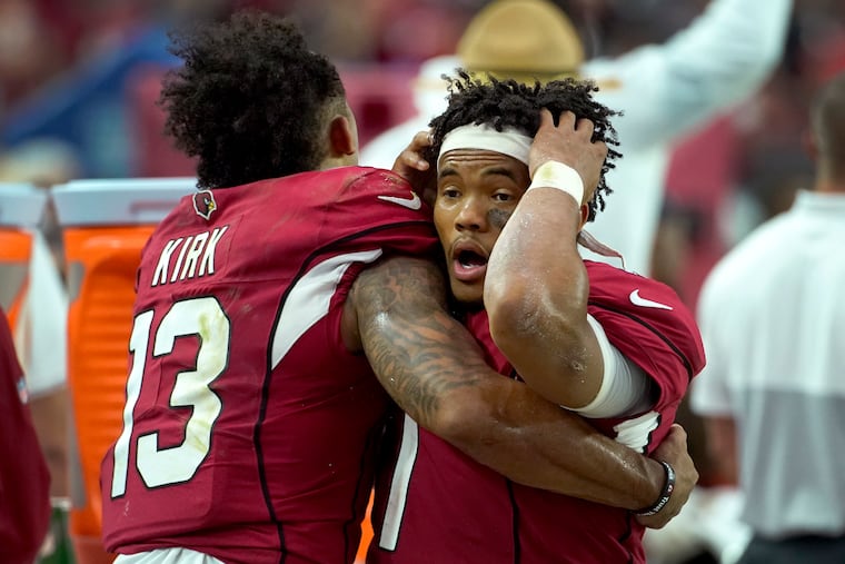 Arizona Cardinals quarterback Kyler Murray (right) reacts with wide receiver Christian Kirk during the final seconds of Sunday's tie with Detroit.