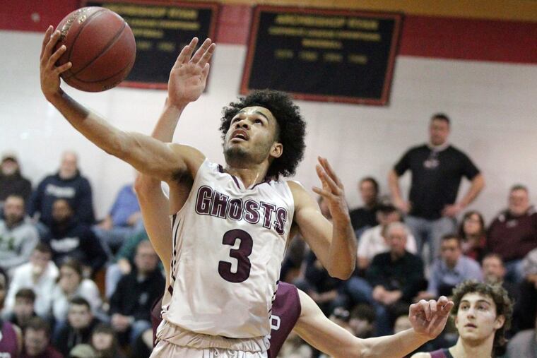 Robbie Heath of Abington scores on a reverse layup against St. Joseph’s Prep as he goes up for a shot in the fourth quarter on Wednesday.