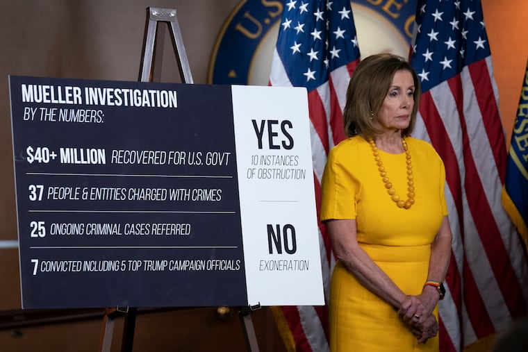 Speaker of the House Nancy Pelosi, D-Calif., stands beside a chart during a newss conference following the back-to-back hearings with former special counsel Robert Mueller who testified about his investigation into Russian interference in the 2016 election, on Capitol Hill in Washington, Wednesday, July 24, 2019. (AP Photo/J. Scott Applewhite)