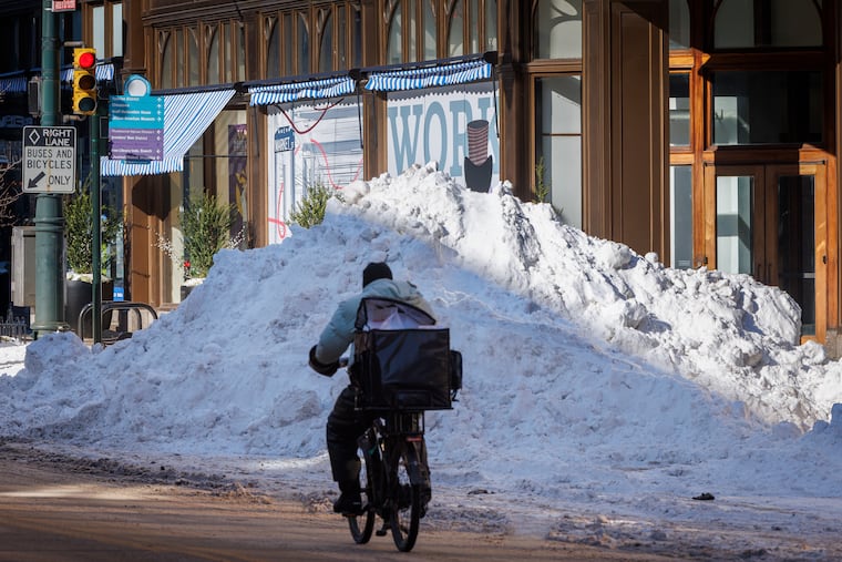 Snow is piled up on the northeast corner of Market and Seventh Streets on Tuesday.