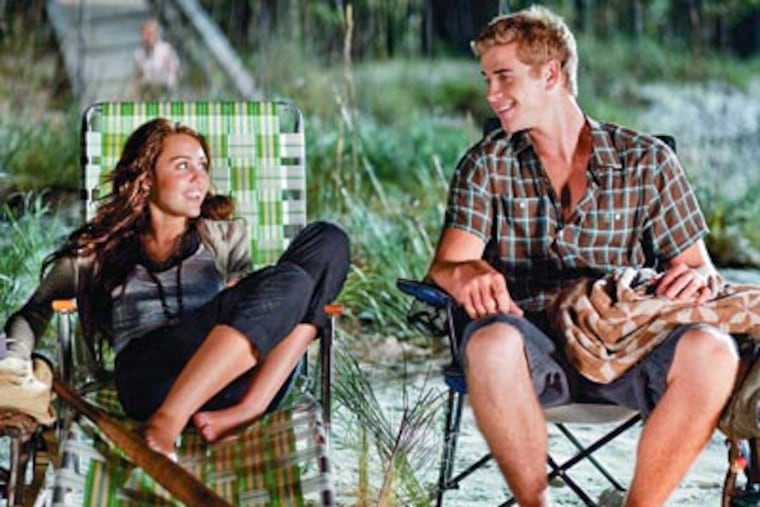 Miley Cyrus stars as Veronica 'Ronnie' Miller and Liam Hemsworth stars as Will Blakelee in Walt Disney Pictures' The Last Song. (Credit: Walt Disney Pictures)