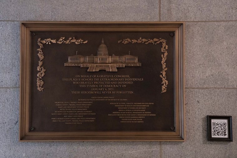 A plaque honoring police service on Jan. 6, 2021, hangs in the U.S. Capitol shortly after being installed on March 7.