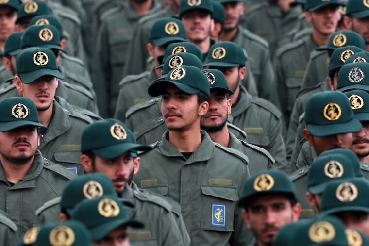 FILE - In this Feb. 11, 2019 file photo, Iranian Revolutionary Guard members attend a ceremony celebrating the 40th anniversary of the Islamic Revolution, at the Azadi, or Freedom, Square in Tehran, Iran. The Trump administration on Wednesday granted important exemptions to new sanctions on Iran’s Revolutionary Guard, watering down the effects of the measures while also eliminating an aspect that would have complicated U.S. foreign policy efforts. (AP Photo/Vahid Salemi)