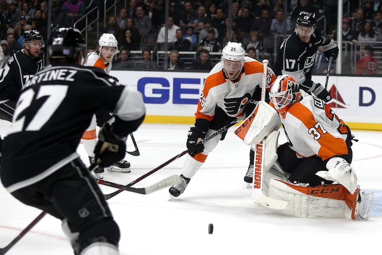 Goalie Brian Elliott makes save on a shot by Los Angeles Kings defenseman Alec Martinez during the Flyers' 5-2 win Thursday.