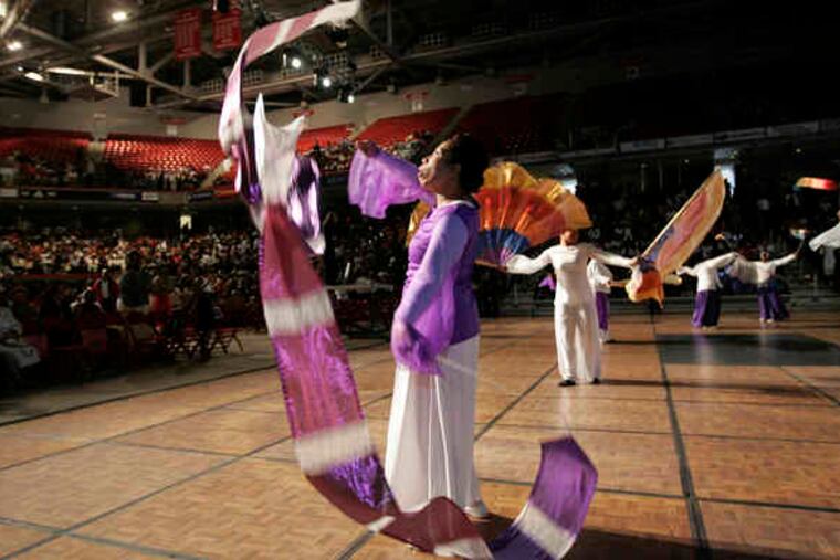 Myya Stinson and others in the Spirit of David Adult Dance ministry from Enon Tabernacle Baptist Church open the Easter serviceat the Liacouras Center. The service also featured other performers and a teleconference prayer with congregants in South Africa.