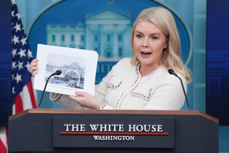 White House press secretary Karoline Leavitt displays a historic photo of the West Wing in 1902 as she discusses the construction of a new ballroom after the demolition of the East Wing on Thursday.