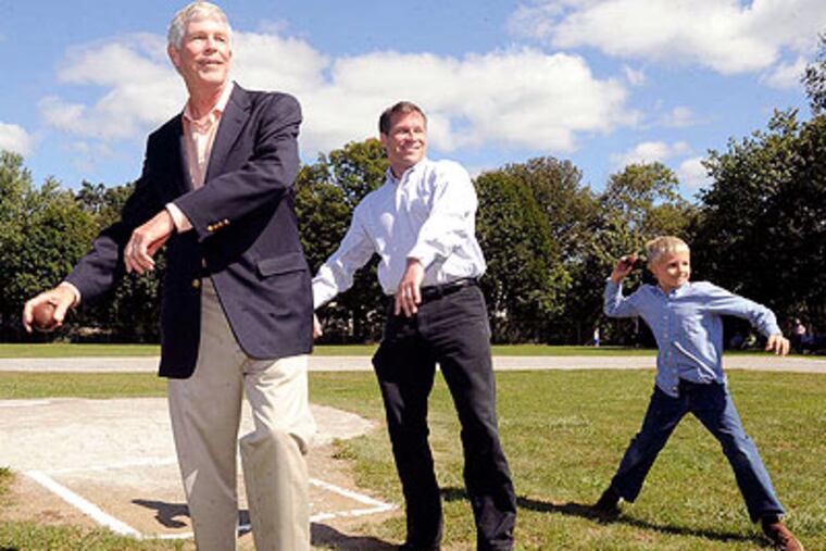 Connie Mack V, 9, is joined by his grandfather, Connie Mack III, and father, Connie Mack IV. (John Ferrarone/For The Inquirer)