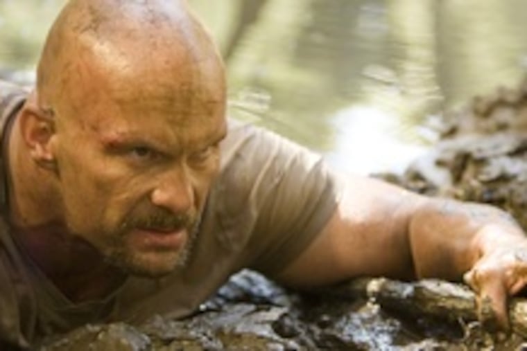 Stone Cold Steve Austin is one of 10 convicts freed from jail to engage in a pay-TV fight-to-the finish survival contest, with the winner going free.