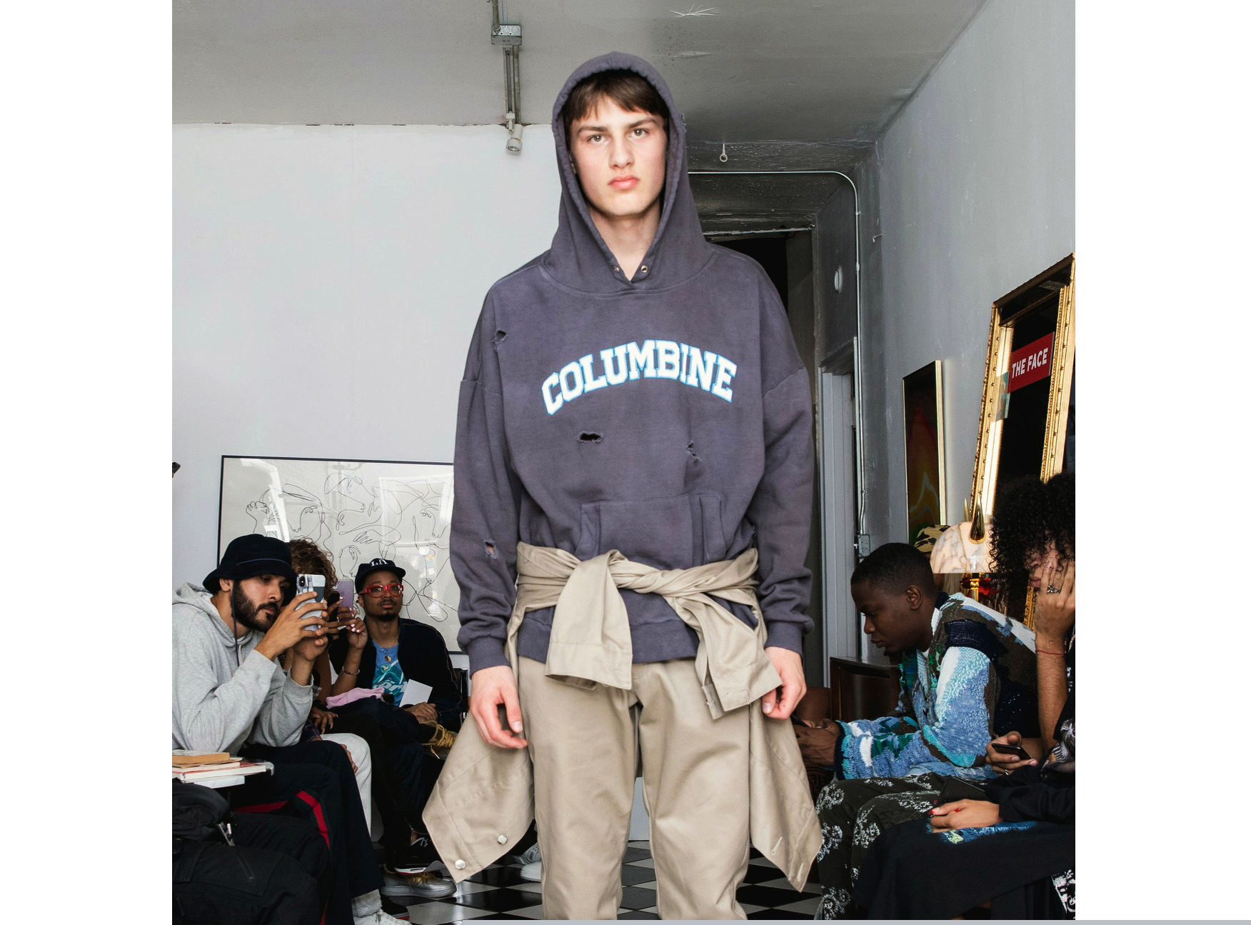 In this Friday, Sept. 13, 2019 photo provided by Bstroy, models at a show for fashion brand Bstroy wear hoodies emblazoned with the names of schools touched by mass shootings at an apartment in the Soho neighborhood of Manhattan in New York. The hoodies have created a backlash from critics who say they glamorize violence and aim to profit from tragedy. Bstroy co-founder Dieter Grams says the hoodies are an effort to bring attention to gun violence and are not for retail sale. (Bstroy via AP)