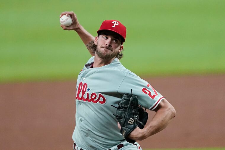 Philadelphia Phillies starting pitcher Aaron Nola (27) works against the Atlanta Braves in the first inning of a baseball game Friday, Aug. 21, 2020. He didn't get out of the third inning.