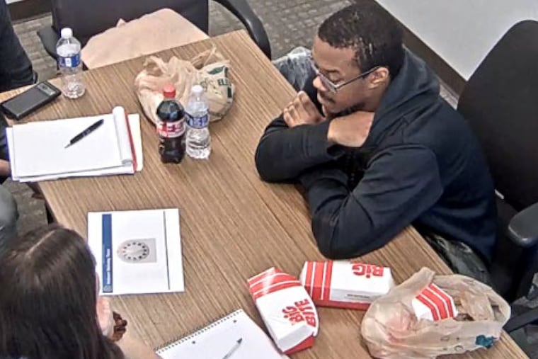 This image from video contained in a Justice Department court filing shows Brian J. Cole Jr., being interrogated by FBI investigators in Woodbridge, Va., Dec. 4, 2025.