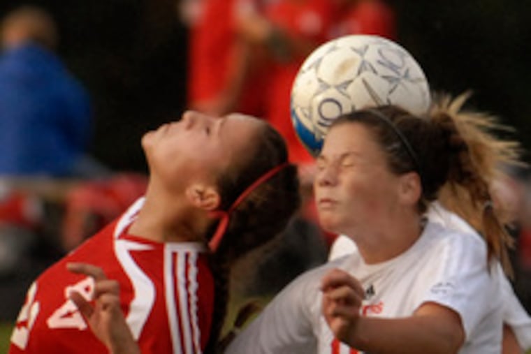 Cinnaminson's Tina Roach (right) and Rancocas Valley's Jenna Mirabelli do battle. Cinnaminson suffered its first loss.