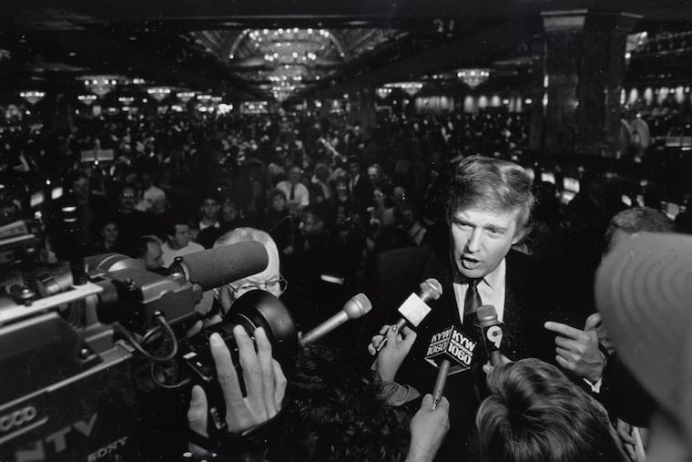Donald Trump speaks to reporters on opening day of the Taj Majal casino in Atlantic City in April 1990.