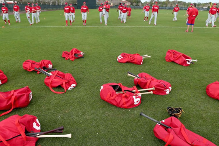 The Phillies stretch behind their bags. (David Swanson/Staff Photographer)